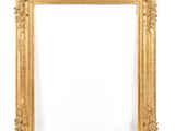 an antique gold frame with a white background