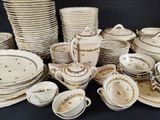 many plates and cups that are sitting on a table