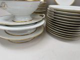 a lot of plates and bowls stacked on top of each other
