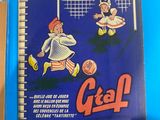 a blue book with a picture of a boy kicking a soccer ball