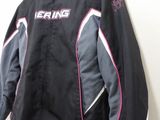 the jacket is hanging on the wall next to the wall