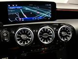 the dashboard of a car with a gps device on the dash