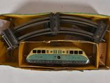 a toy train set in a box on a table
