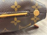 a close up of a purse on a table