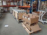 many boxes on the pallets in the warehouse