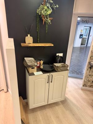 a bathroom with a sink and a mirror on the wall