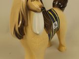 a figurine of a dog with a tie on it