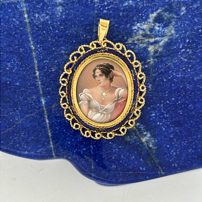 a picture of a picture of a woman in a dress on a blue stone