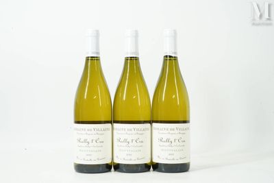 three bottles of white wine are lined up on a white surface
