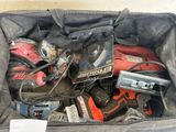 a bag full of power tools and tools in it