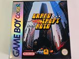 an image of a gameboy game box with a picture of a city in the background