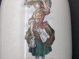 a white vase with a picture of a woman on it