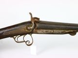 a close up of a gun on a white surface