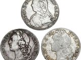 three different types of silver coins on a white background