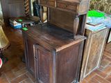 a wooden desk with a drawer on top of it in a room