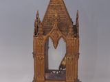 a small wooden structure with a clock on top of it