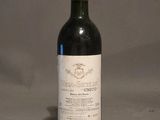 a bottle of wine that is sitting on a table