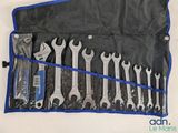 a set of wrenches and other tools in a bag