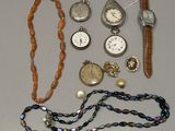 many different types of watches and bracelets laid out on a table