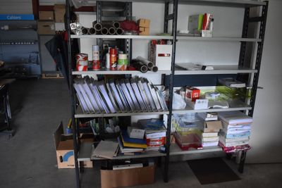a shelving with many items on it in a garage