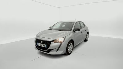 a silver car in a white room with a white floor