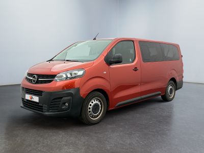 the red van is parked in the empty room of the building