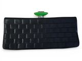 black leather wallet with a green button on top of it