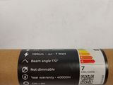 an image of a roll of brown paper on a white surface