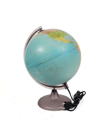 a small blue and green globe on a metal stand