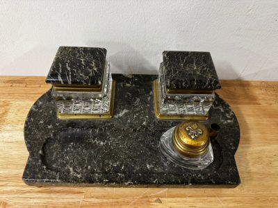 pair of marble and brass candlesticks on a marble base