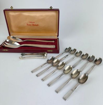 a lot of spoons in a case on the table