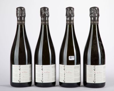 three bottles of wine sitting next to each other on a table