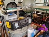 a lot of clutter in a garage with a lot of tools