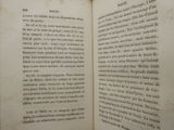 an open book that has a picture of a cat on it