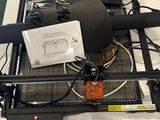 a table with a lot of wires and a blower