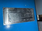 a close up of a blue machine with a label on it