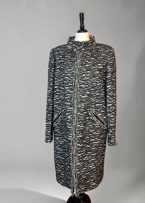 a black and white coat on a mannequin mannequin mannequin mannequin mannequin mannequin mannequin mannequin mann