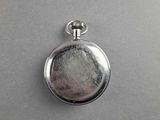 a silver pocket watch with a chain hanging from it