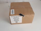 a brown box with a black handle sitting on a white surface