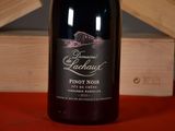 a bottle of wine that is sitting on a table