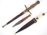 three different types of knifes on a white surface
