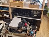 a desk with a lot of electronics on top of it