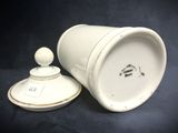 an image of a white cup with a lid sitting on a table