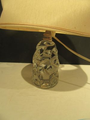 a lamp that is sitting on a table next to a plate