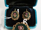 an image of a jewelry set in a blue box on a white surface