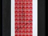 a framed picture of a red and white picture with a signature on it