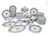 a lot of plates and bowls that are sitting on a table