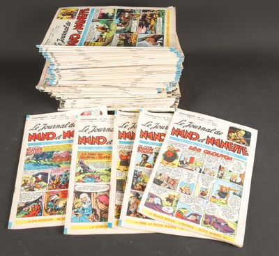 several comics are stacked on top of each other on a table