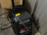 an image of a power washer with a box in the background