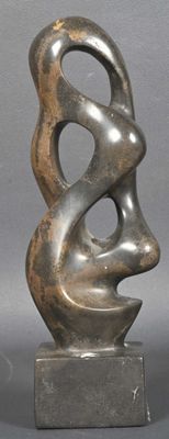 statue of a woman ' s face on a base with a gray background